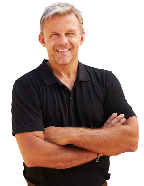 A smiling man in a black shirt with crossed arms, in the shower.