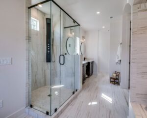 A bathroom remodel featuring a tub to shower conversion.