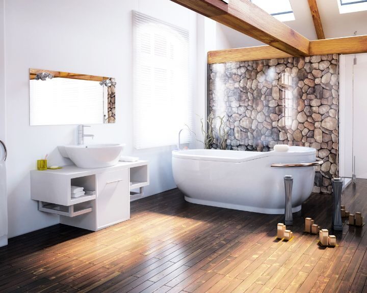 A white bathroom with wooden floors and a bathtub.