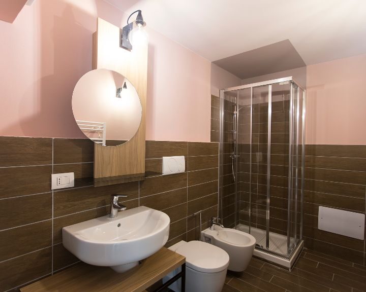 A bathroom with a sink and shower.