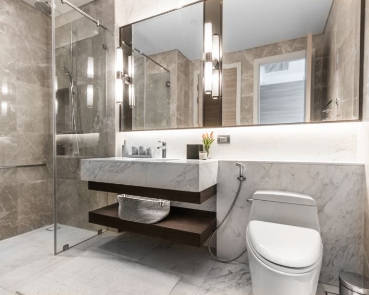 A marble bathroom with a shower.