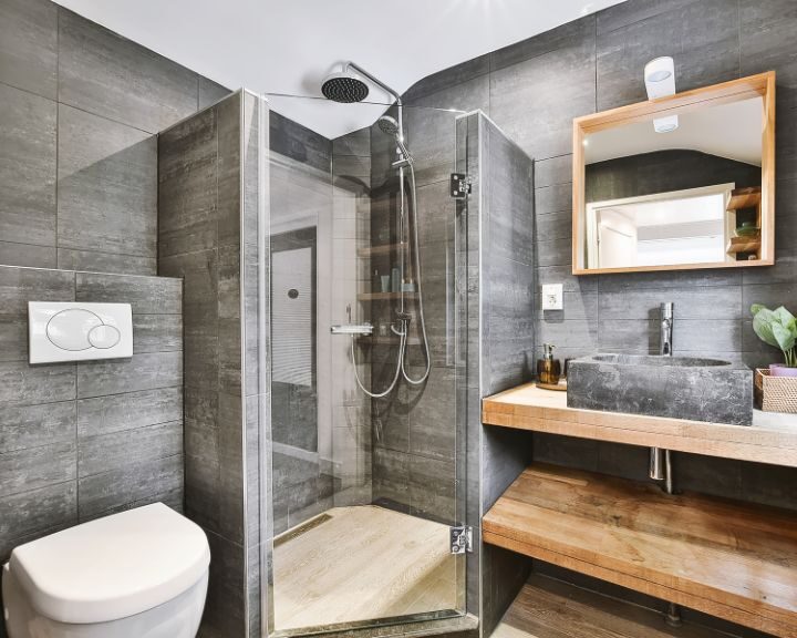 A modern bathroom with a glass shower stall and sleek design.