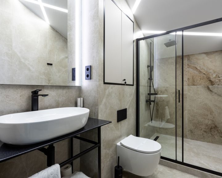 A modern bathroom with a glass shower.