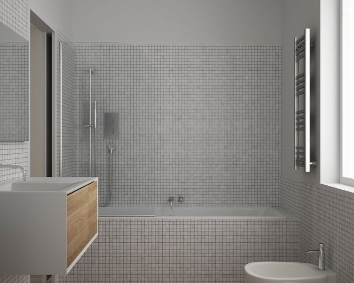 A city bathroom with white tiled flooring.