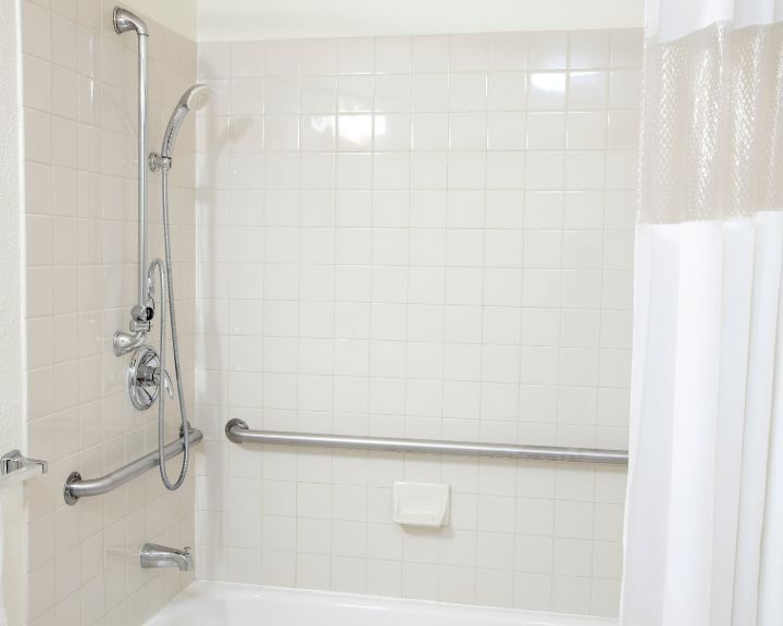 A handicap accessible shower that has been installed for tub to shower conversion.